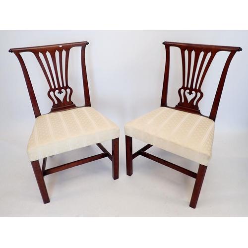 1299 - A pair of Georgian Chippendale style mahogany dining chairs with vase form splat and scroll over top... 