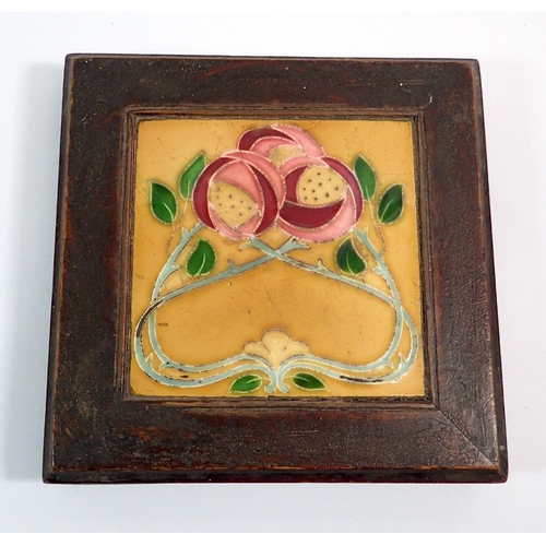 13 - An Art Nouveau tile trivet or stand, 24cm square