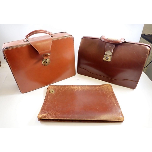 1300 - Two leather vintage brief cases and a document wallet