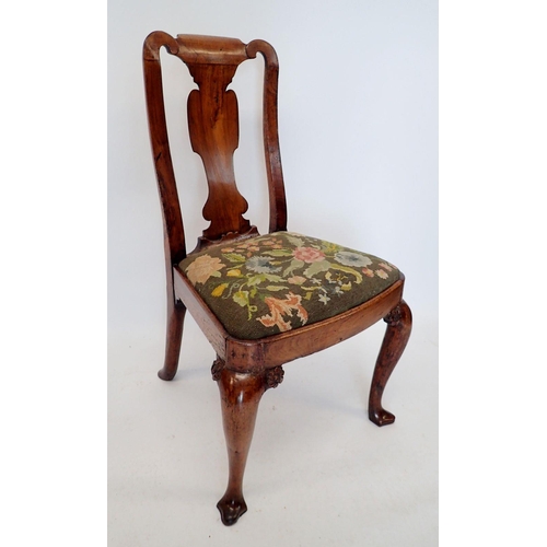 1302 - A George I walnut chair with vase shaped splat and drop in woolwork tapestry seat, all raised on cab... 