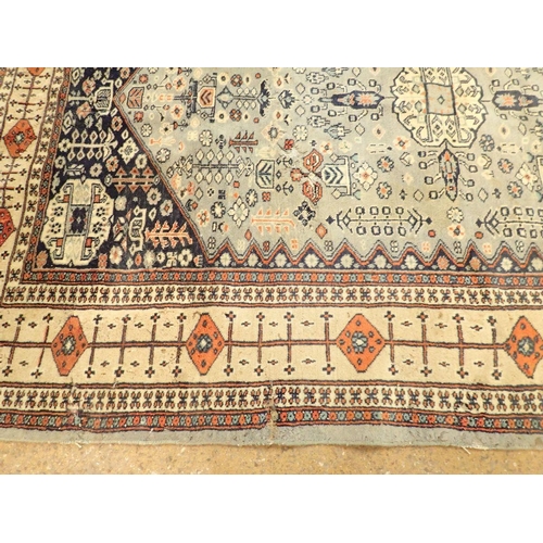 1307 - A Turkoman style rug with stylised floral motifs on a blue grey ground 188 x 123cm