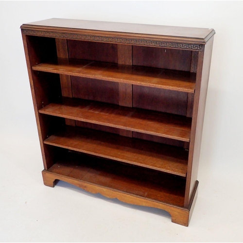 1308 - An Edwardian walnut open bookcase with blind fretwork decoration to frieze, 91cm wide