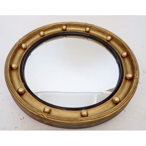 1309 - An Edwardian circular convex mirror with gilt ball border, 44cm diameter