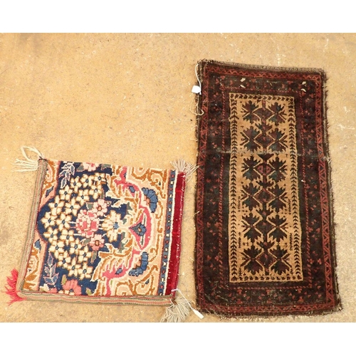 1314 - A Turkoman saddle bag with geometric design and a floral rug cushion cover