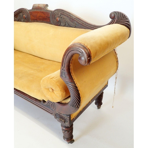 1316 - A fine Regency mahogany sofa with carved scroll back, scroll over arms and turned supports, 205cm wi... 