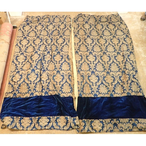 1317 - A pair of vintage blue and gilt foliate curtains with velvet banding, 216cm wide x 267cm drop