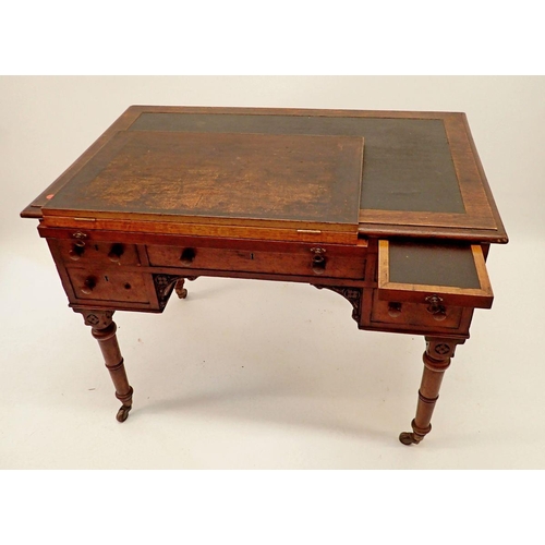 1329 - A Victorian oak desk with frieze drawer and two pairs of small drawers all on turned supports, 107 x... 