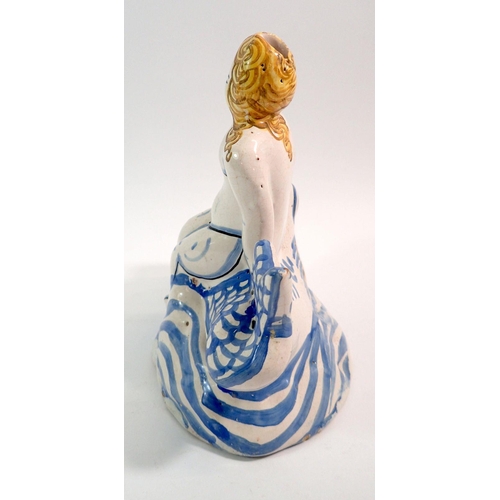 133 - An 18th century Delft figure of a woman seated on a fish, 18.5cm tall, with authentication certifica... 