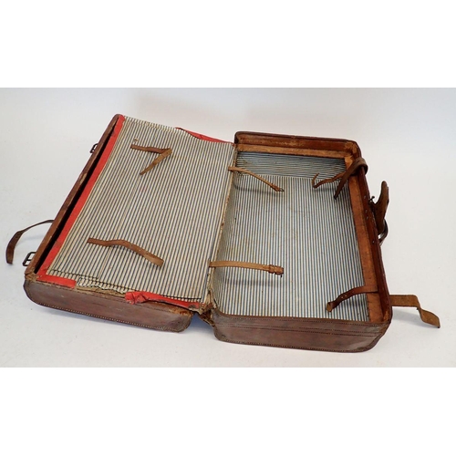 1343 - An antique leather suitcase by Northam of Exeter, 60cm wide