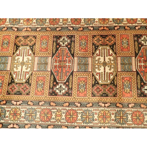 1348 - A machine made Turkoman style rug with geometric motifs 230 x 93cm