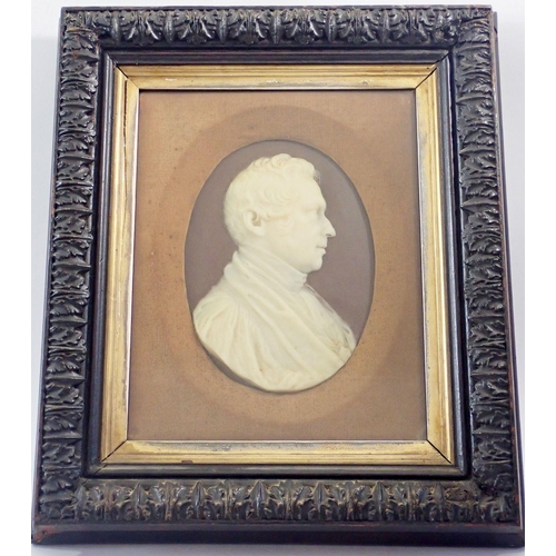 1361 - A 19th century wax portrait bust of the Rev Sumner in carved frame, 37 x 33cm overall