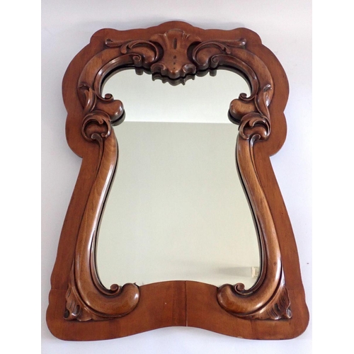 1366 - A mahogany wall mirror with carved scroll inner border, 68 x 48cm