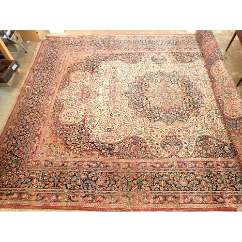 1373 - A large Persian carpet with medallion and scrolling floral design within multiple borders 440 x 311c... 