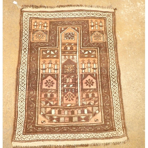 1374 - A Turkoman style rug with geometric design on a coral ground 131 x 95cm