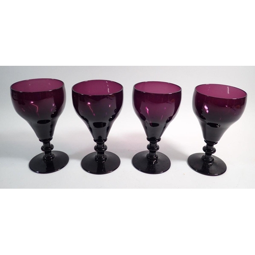 147 - A 19th century set of four large purple wine glasses, 14cm tall