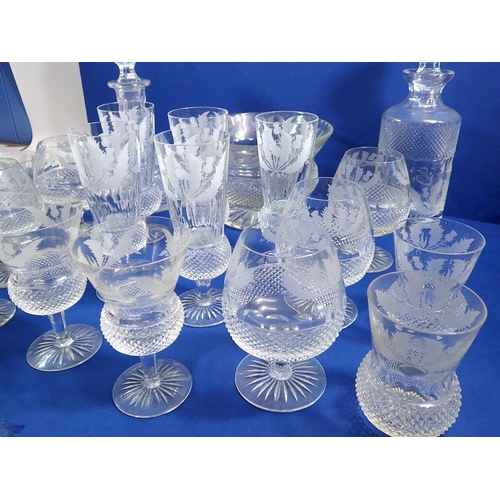 151 - An Edinburgh Crystal Thistle part suite of drinking glasses comprising two decanters, five brandy gl... 