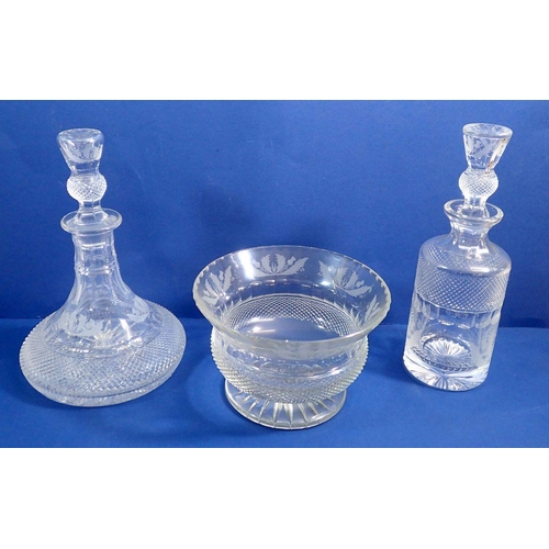 151 - An Edinburgh Crystal Thistle part suite of drinking glasses comprising two decanters, five brandy gl... 