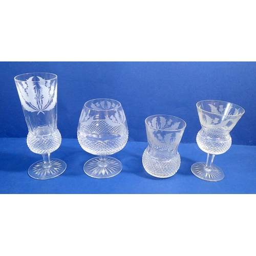 151 - An Edinburgh Crystal Thistle part suite of drinking glasses comprising two decanters, five brandy gl... 