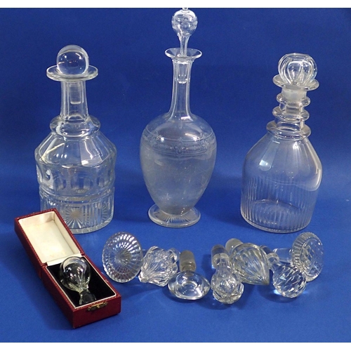 168 - Three 19th century glass decanters and a box of stoppers