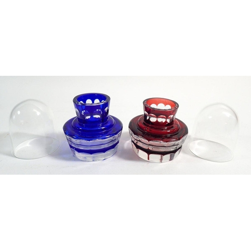 174 - A pair of red and blue overlaid and cut glass tooth pick holders and covers, 7cm