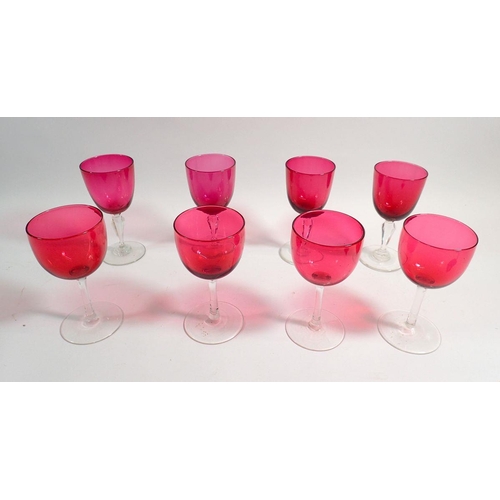 179 - A set of four cranberry wine glasses and four others