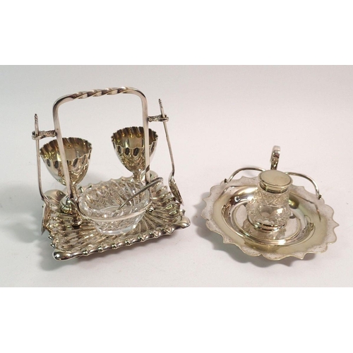 188A - An Edwardian silver plated eggcup stand for two with cut glass salt and silver plated and cut glass ... 