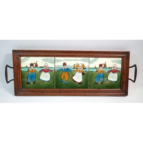 19 - An oak 1930's framed tray inset three Dutch tiles, 57 x 20cm overall