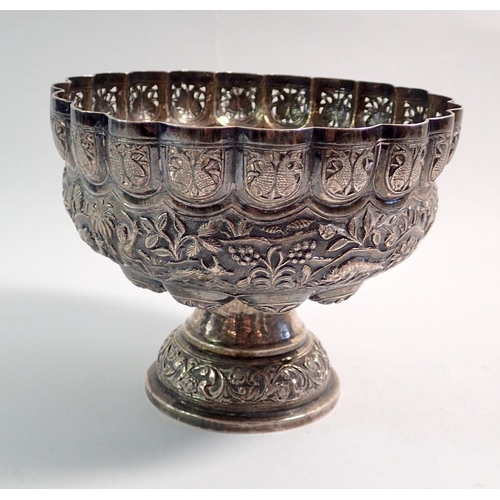 196 - An Indian silver fruit bowl with pierced rim and embossed decoration of elephants and other animals,... 