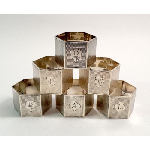 199 - A set of six silver hexagonal napkin rings each engraved initial by Turner and Simpson, Birmingham 1... 