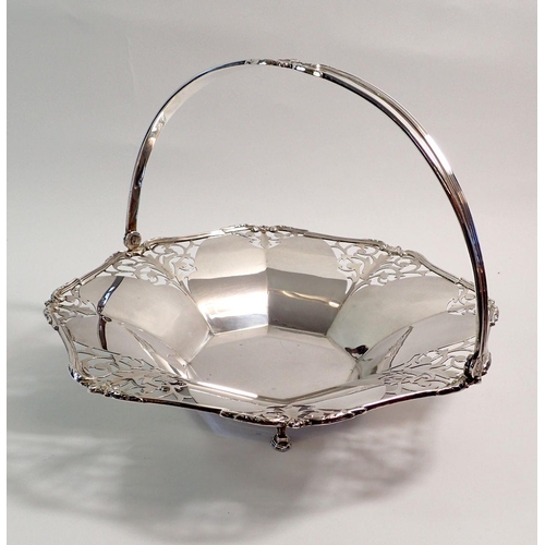 201 - A silver swing handle pierced cake basket on hoof feet, Birmingham 1935 by I S Greenberg, 563g