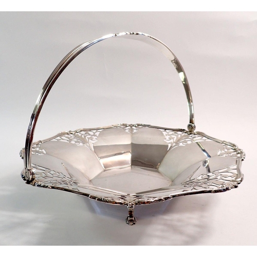 201 - A silver swing handle pierced cake basket on hoof feet, Birmingham 1935 by I S Greenberg, 563g