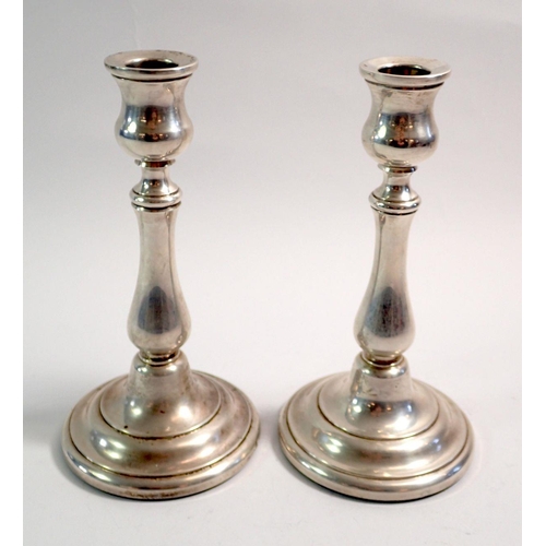 202 - A pair of silver baluster candlesticks, 19cm tall, London 1988, by Hersey & Son