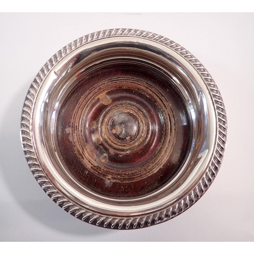 211 - A silver and turned mahogany wine coaster, Birmingham 1939, 15.5cm diameter