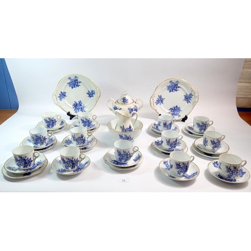 24 - A Victorian blue floral tea service with thirteen cups and saucers, ten side plates, two covered sug... 