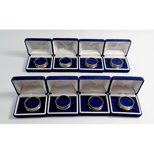 243 - A set of eight silver napkin rings all individually boxed, Birmingham 1996 W I Broadway & Co, 88g