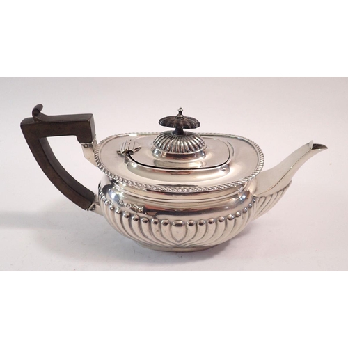 247 - A silver half gadrooned teapot, Birmingham 1910, 348g