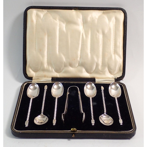 253 - A set of six silver spiral stem teaspoons and tongs, boxed, Sheffield 1928, Cooper Brother and Sons,... 