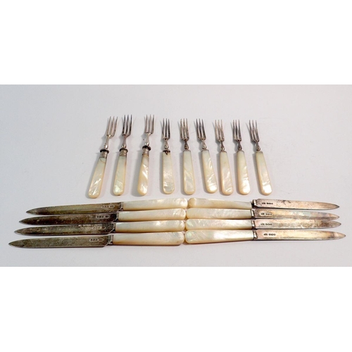 262 - A mother of pearl and silver set of dessert cutlery comprising eight knives and six forks plus three... 