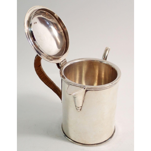 268 - An Edwardian silver argyle with cane handle, Sheffield 1907 by Martin & Hall, 475g, 14cm tall