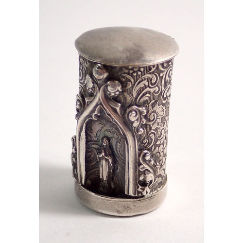 273 - A 19th century continental white metal smelling salts cylindrical box in the form of devotional temp... 