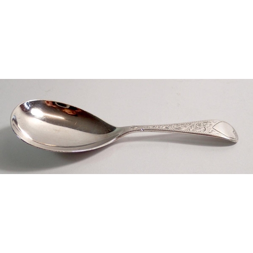 275 - A silver caddy spoon with engraved decoration, Birmingham 1910, 26g