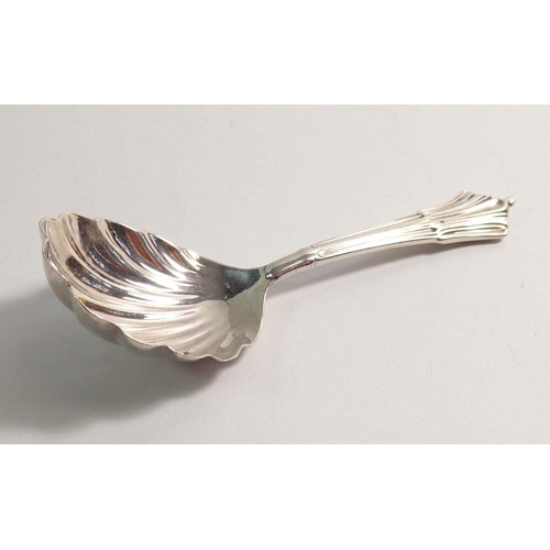 277 - A silver caddy spoon with shell bowl, London 1901, by Goldsmiths and Silversmiths Co. Ltd, 10cm