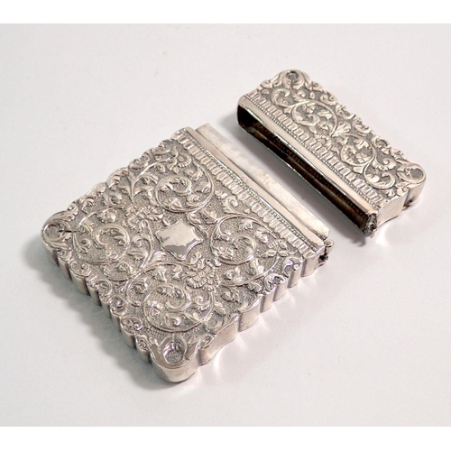 286 - An Indian white metal card case with all over scrollwork decoration - hinge a/f