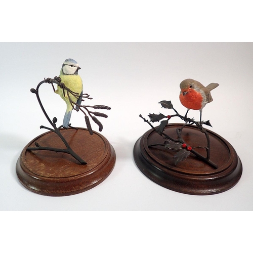 29 - A Coalport Robin and Blue Tit perched on bronze finish branches and wooden stands, Blue Tit 14cm