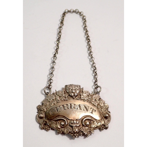 292 - A silver 'CURRANT' bottle ticket or decanter label decorated lion mask and vines, London 1821, by Ge... 