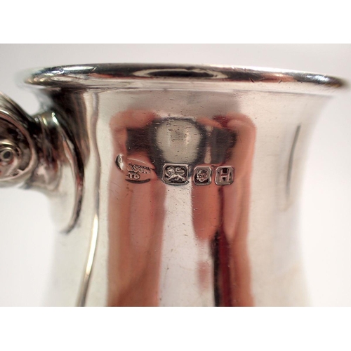 295 - A silver small tankard on plinth foot engraved date and initials, 10.5cm tall, London 1943, 270g