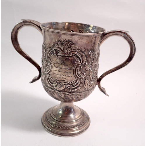 302 - A George III silver two handled loving cup with embossed shell and flower decoration by Peter & Ann ... 