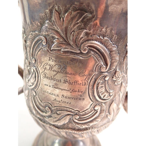 302 - A George III silver two handled loving cup with embossed shell and flower decoration by Peter & Ann ... 