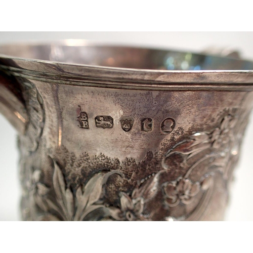 302 - A George III silver two handled loving cup with embossed shell and flower decoration by Peter & Ann ... 