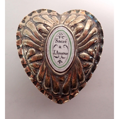 307 - A Victorian silver heart form trinket box with enamel insert to lid 'Sacre a L'Amour' 5cm, London 18... 